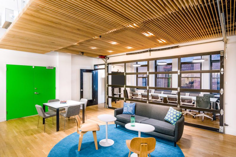 Gust’s small breakout room with acoustic paneling near an open office zone. Source: Blueberry Builders