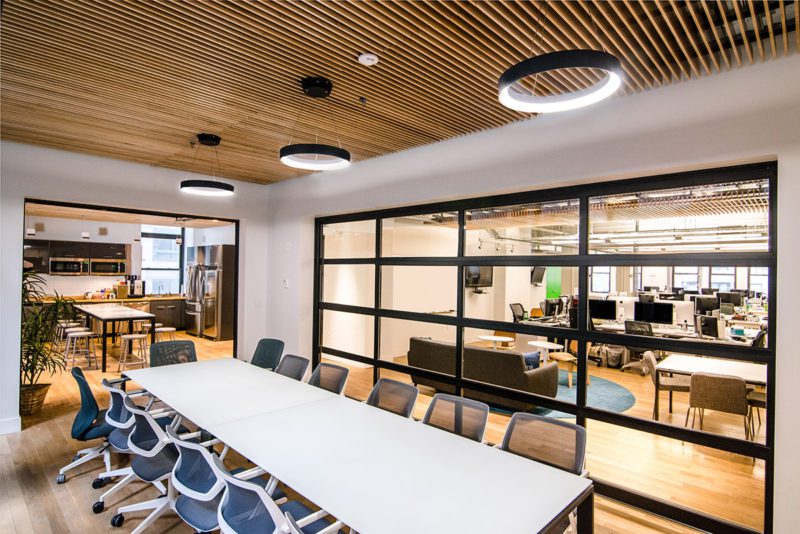 Open-plan zone built for Gust showing hoteling desks and shared collaboration space. Source: Blueberry Builders