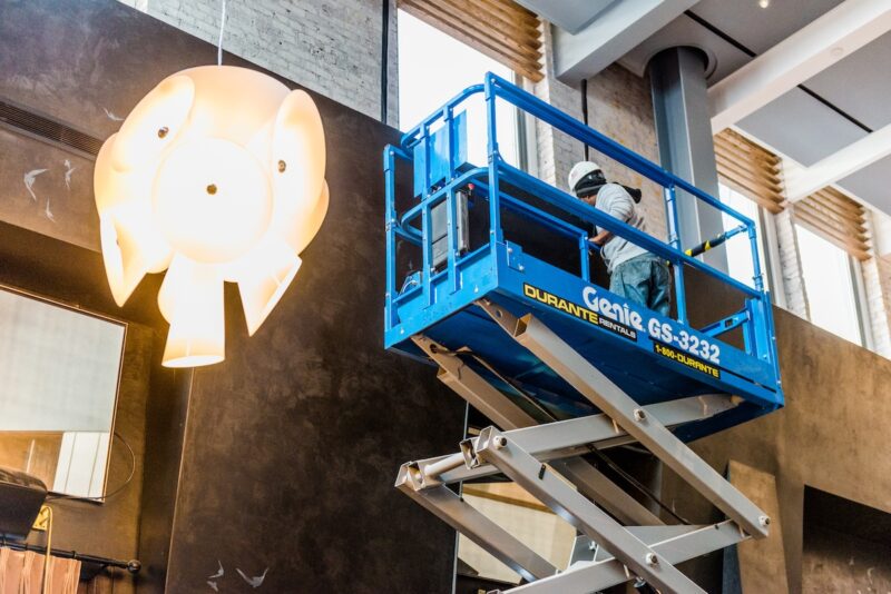 Blueberry Builders contractor working on scaffolding at commercial client's rebuild