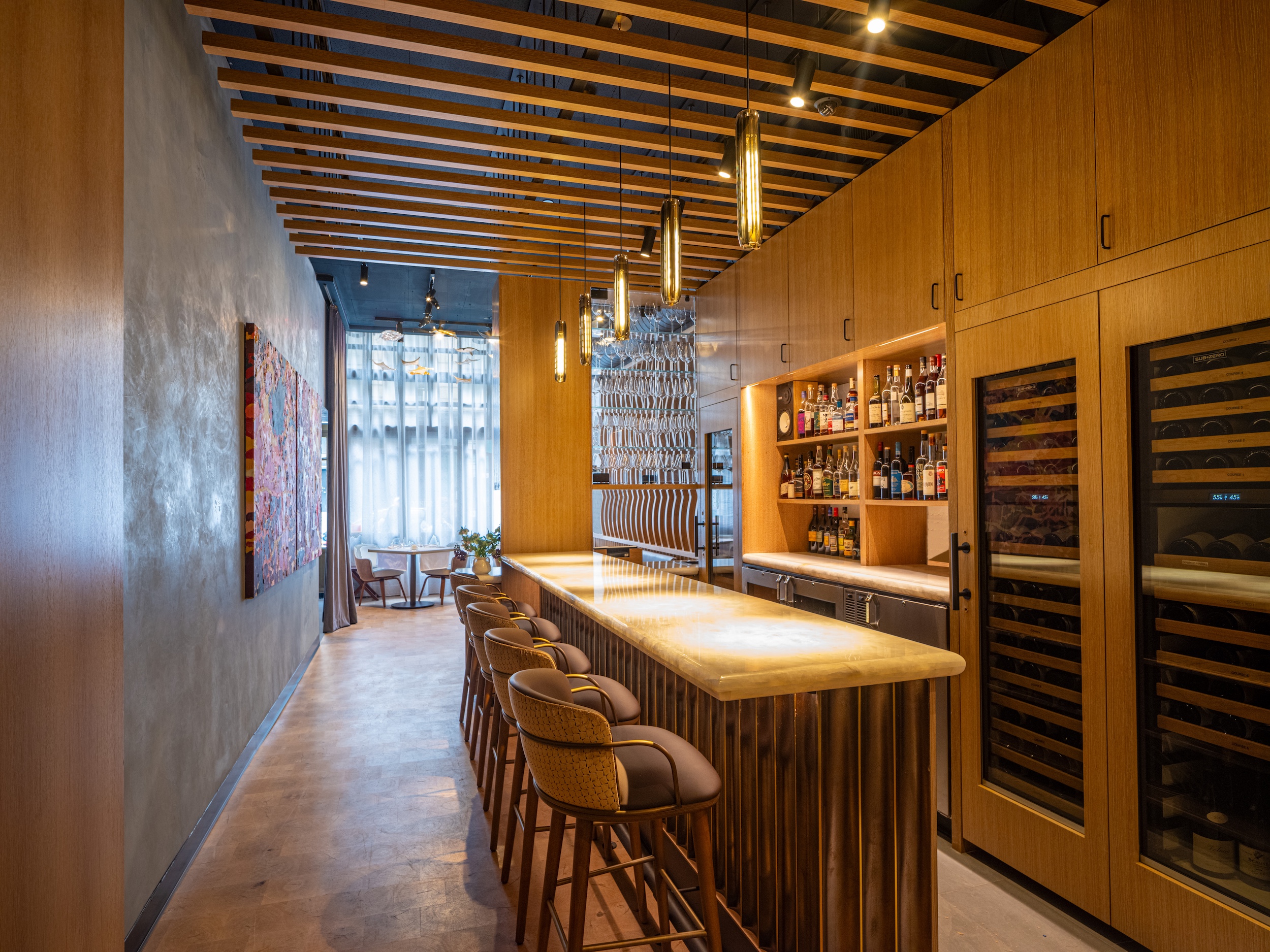 Saint Urban Bar area with feature wall and art located in Manhattan's Gramercy neighborhood
