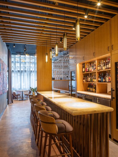 Saint Urban Bar area with feature wall and art located in Manhattan's Gramercy neighborhood